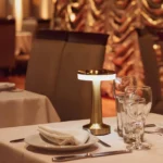 rechargeable table lamp malta: Rechargeable table lamp in gold metal with lit ring light under the round top, used cordless o