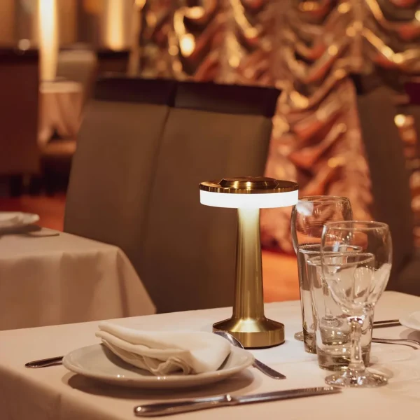 rechargeable table lamp malta: Rechargeable table lamp in gold metal with lit ring light under the round top, used cordless o