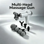 massage gun malta: White cordless massage gun with chrome trim, five-ball head fitted, plus ball, roller, fork, flat and bull
