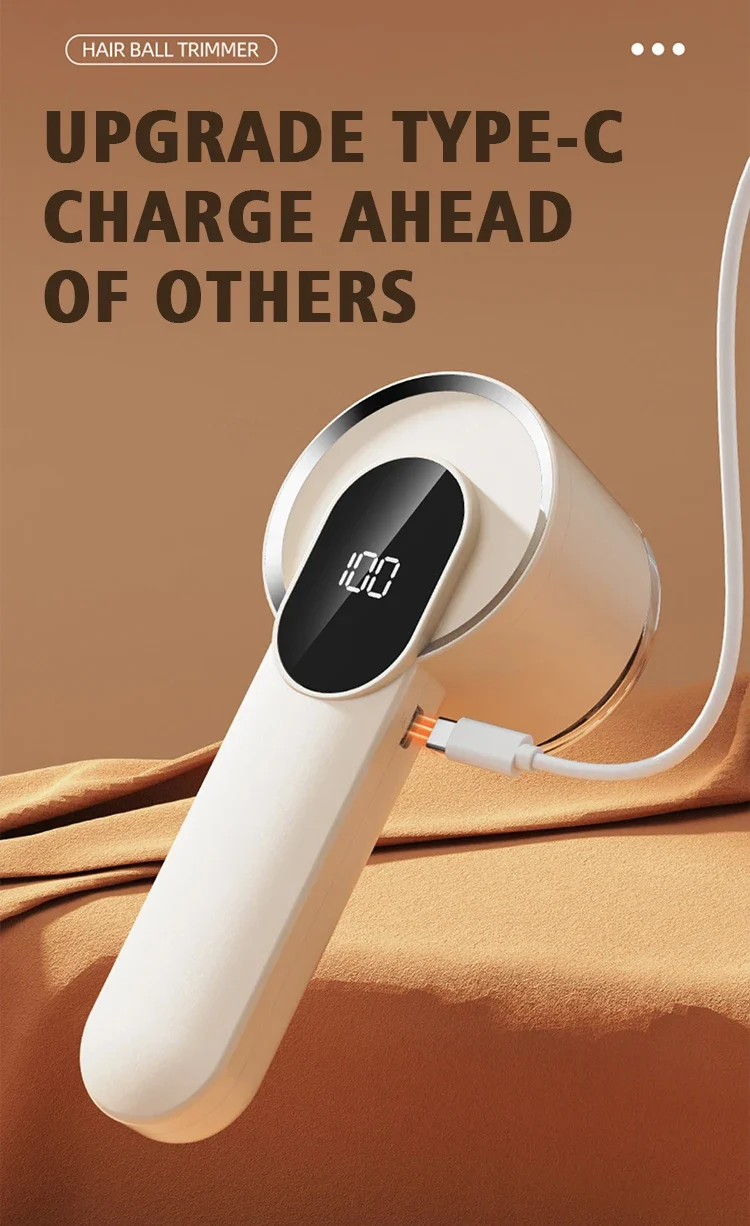 Fabric shaver charging through a Type-C cable plugged into the side of the handle